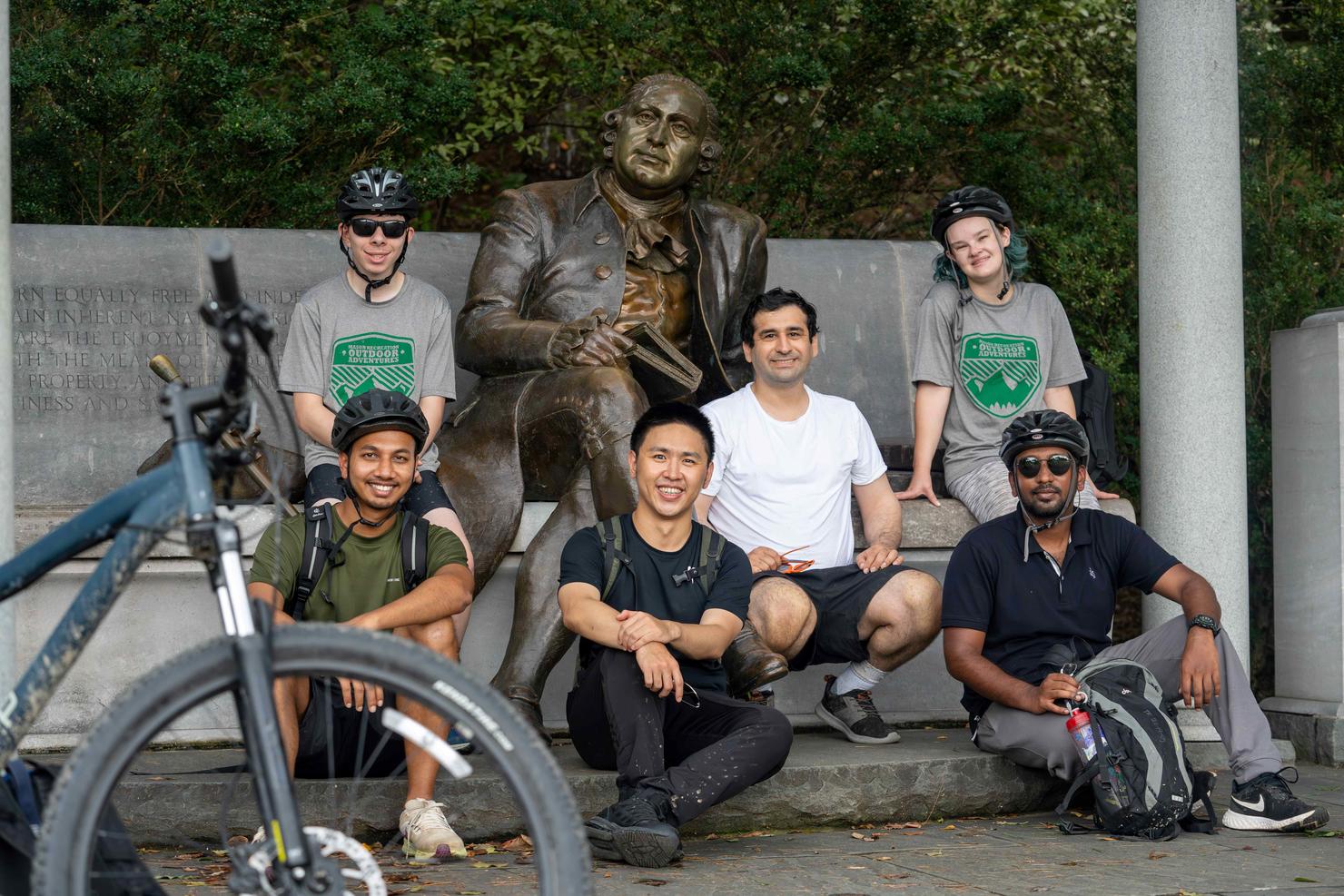 A group of cyclists take a break at the George Mason Memorial in Washington, D.C.