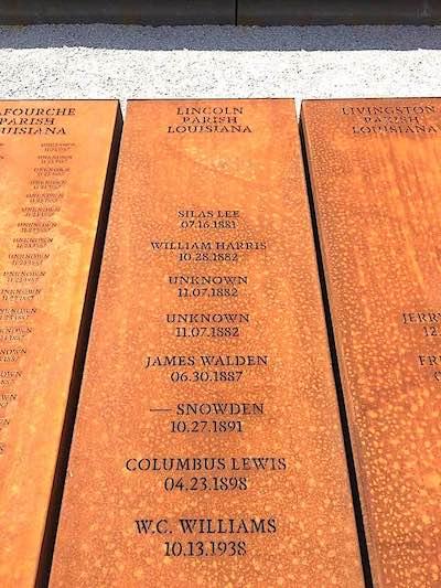 photo of names engraved on a post