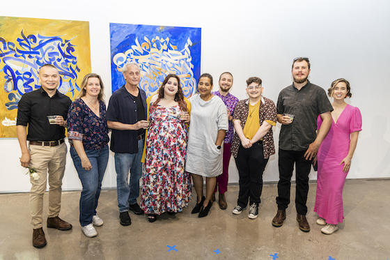 From left: Steven Lou, Michelle A. Smith, and Peter Winant with other Mason artists at Mason Exhibitions Arlington for the "Edges of What I Feel" opening.